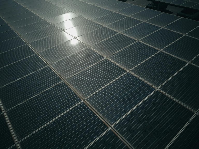 Captivating close-up of solar panels reflecting sunlight, showcasing renewable energy technology.
